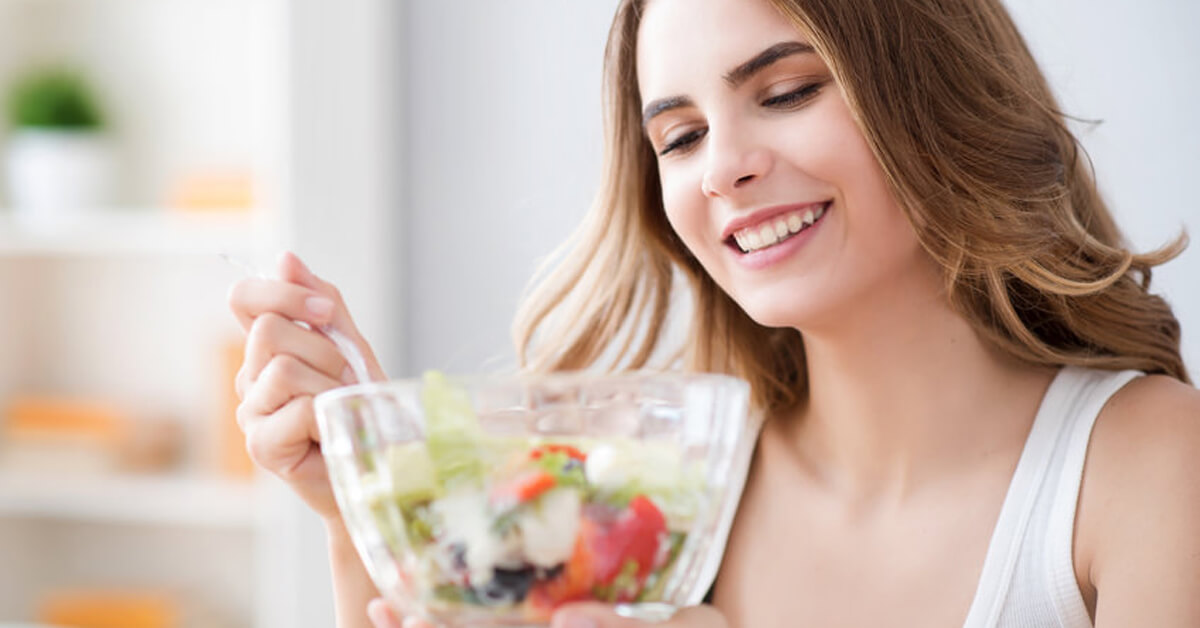 women eating salad